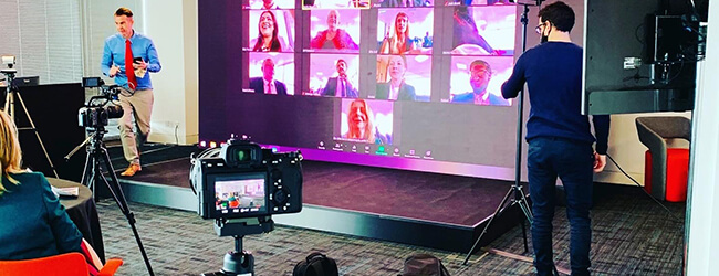 cameras filming a virtual hybrid event stage