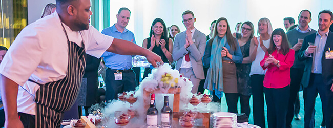 chef showing party guests food