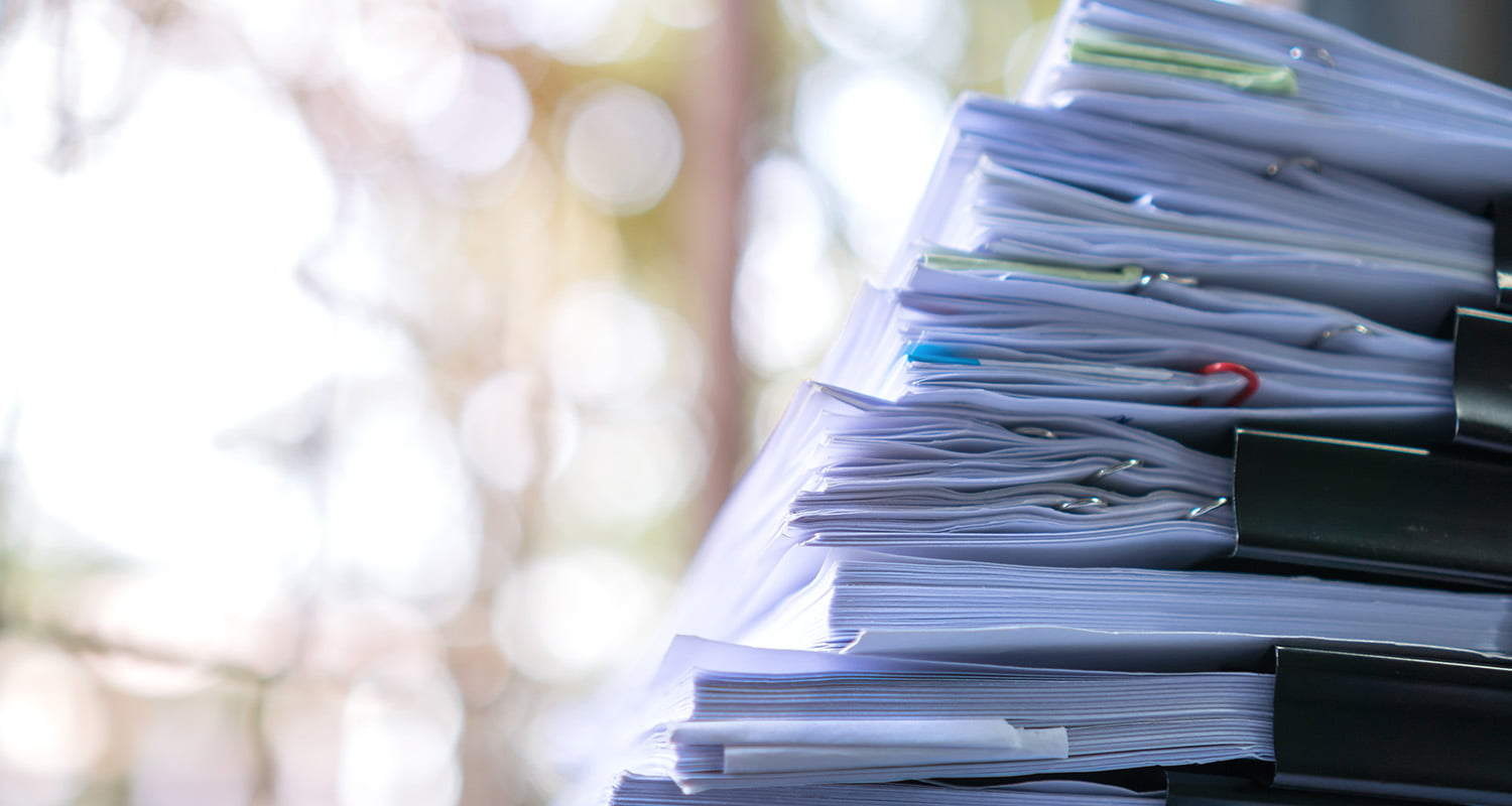 stack of paper reports