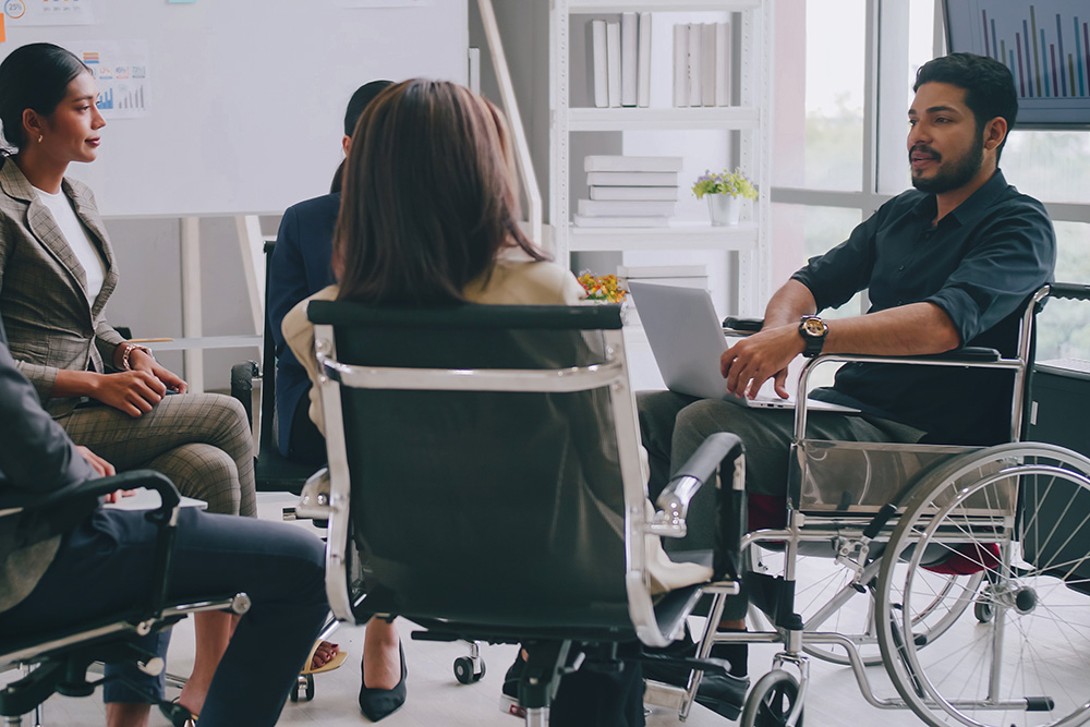 Meeting with man in wheelchair.