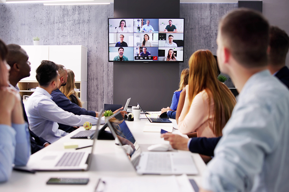 People in office in video call meeting